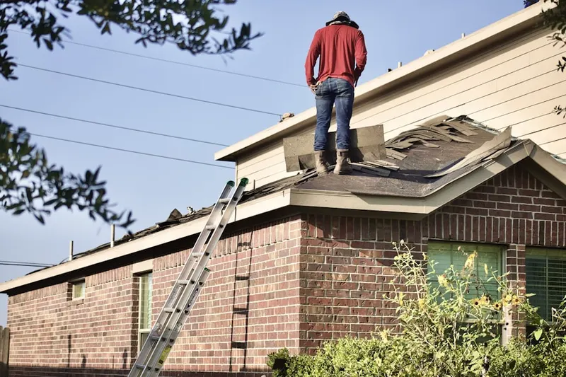 Professional roofer working on a residential roof in University of Nevada
